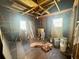 Interior view of the home shows exposed wood framing and construction debris at 2120 Thornlee Dr, North Charleston, SC 29405