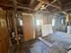 Damaged room featuring exposed beams, walls, and flooring awaiting renovation at 2120 Thornlee Dr, North Charleston, SC 29405