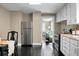 Kitchen area with stainless steel fridge and dining area and view of living area at 2120 Thornlee Dr, North Charleston, SC 29405