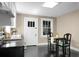 Eat-in kitchen featuring black appliances and a dining table at 2120 Thornlee Dr, North Charleston, SC 29405