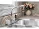 Close-up of a sink with a chrome faucet and running water at 2120 Thornlee Dr, North Charleston, SC 29405