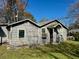A sunny-day shot of an unattached garage with weathered wood siding at 2120 Thornlee Dr, North Charleston, SC 29405