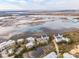 Comprehensive aerial scene of marsh view townhouses interwoven with scenic water features and local foliage at 2135 Tides End Rd, Charleston, SC 29412