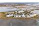 Sprawling aerial view capturing townhouses set against a backdrop of natural waterways and coastal vegetation at 2135 Tides End Rd, Charleston, SC 29412