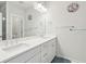 Bright bathroom with double sinks, modern faucets, and a large mirror at 2135 Tides End Rd, Charleston, SC 29412