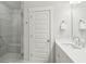 Bathroom with a glass shower, a door to the hallway, and ample counter space at 2135 Tides End Rd, Charleston, SC 29412