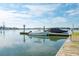 Dock view showcasing boat moorage and scenic waterfront views under a partly cloudy bright sky at 2135 Tides End Rd, Charleston, SC 29412