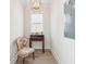 Quaint hallway features a decorative chair, desk, and lighting fixture at 2135 Tides End Rd, Charleston, SC 29412