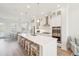 Bright, open kitchen with a large island, seating, stainless steel appliances, white cabinetry, and modern lighting at 2135 Tides End Rd, Charleston, SC 29412