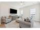 Bright and airy living room with stylish furnishings and a modern ceiling fan, perfect for relaxation and entertainment at 2135 Tides End Rd, Charleston, SC 29412