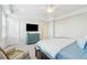 Main bedroom has a king-sized bed, TV, dresser, and is brightly lit with natural light at 2135 Tides End Rd, Charleston, SC 29412