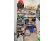 Floor-to-ceiling storage shelving units overflowing with various household goods, towels, and pantry staples at 2135 Tides End Rd, Charleston, SC 29412