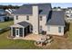 Spacious backyard with a fire pit, seating area, screened porch, and lush green lawn perfect for outdoor enjoyment at 219 Daybreak Blvd, Summerville, SC 29486