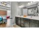 Modern bathroom featuring double sinks, lots of lights, and a view of an adjoined bedroom at 219 Daybreak Blvd, Summerville, SC 29486