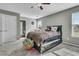 Cozy bedroom with a ceiling fan, carpet, and lots of natural light from two windows at 219 Daybreak Blvd, Summerville, SC 29486