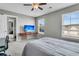 Bedroom featuring a TV mounted on the wall, two windows, and a connected room at 219 Daybreak Blvd, Summerville, SC 29486