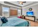 Comfortable bedroom with hardwood floors, ceiling fan, and a large TV for relaxing evenings at 219 Daybreak Blvd, Summerville, SC 29486