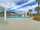 Bright community pool with white pergola and lush palm trees offers a refreshing outdoor retreat at 219 Daybreak Blvd, Summerville, SC 29486