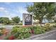 The community entrance sign displays a beautiful magnolia flower and colorful landscaping at 219 Daybreak Blvd, Summerville, SC 29486