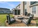 Backyard patio featuring a fire pit and seating area, ideal for outdoor gatherings at 219 Daybreak Blvd, Summerville, SC 29486
