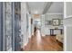 Inviting foyer with hardwood floors, neutral walls, elegant wainscoting, and decorative details throughout at 219 Daybreak Blvd, Summerville, SC 29486