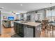 Open-concept kitchen with center island, stainless steel appliances, and views to the living area, ideal for entertaining at 219 Daybreak Blvd, Summerville, SC 29486