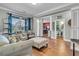 Inviting living room showcasing hardwood floors, neutral paint, and seamless flow into a nearby bathroom and office at 219 Daybreak Blvd, Summerville, SC 29486