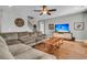 Open living room with hardwood floors, a comfortable couch, and stairs leading up to the second floor at 219 Daybreak Blvd, Summerville, SC 29486