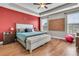 Spacious main bedroom with tray ceiling, large windows, and stylish decor, creating a serene retreat at 219 Daybreak Blvd, Summerville, SC 29486