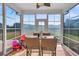 Enclosed sunroom with lots of natural light and views of the backyard at 219 Daybreak Blvd, Summerville, SC 29486