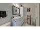 Bathroom with ample lighting, large mirror, vanity with sink, toilet, and linen storage at 2434 Egret Crest Ln, Charleston, SC 29414