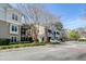 Exterior view of apartment complex with mature trees, manicured lawns, and convenient parking at 2434 Egret Crest Ln, Charleston, SC 29414