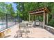 Community grilling area and outdoor seating featuring a built-in grill and landscaping at 2434 Egret Crest Ln, Charleston, SC 29414
