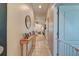 Bright hallway features neutral colors, a console table, and a glimpse into the living area at 2434 Egret Crest Ln, Charleston, SC 29414