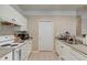 Functional kitchen with white cabinets, neutral walls, granite countertops and stainless steel appliances at 2434 Egret Crest Ln, Charleston, SC 29414