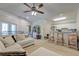 Bright living room with carpet, ceiling fan, neutral paint, and lots of seating near the kitchen at 2434 Egret Crest Ln, Charleston, SC 29414