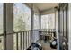 Relaxing screened-in porch with wood flooring, table seating, and view of the outdoors at 2434 Egret Crest Ln, Charleston, SC 29414