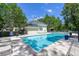 Community swimming pool with lounge chairs, a clubhouse, and a well-manicured outdoor space at 2434 Egret Crest Ln, Charleston, SC 29414