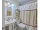 Bathroom featuring a pedestal sink, classic fixtures, and a charming shower curtain at 2765 Jobee Dr # 1303, Charleston, SC 29414