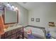 Relaxing bathroom featuring a jacuzzi tub, modern sink, and framed mirror at 2765 Jobee Dr # 1303, Charleston, SC 29414