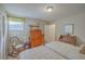 Bright bedroom featuring twin beds, wood furniture, and natural light at 2765 Jobee Dr # 1303, Charleston, SC 29414