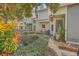 Charming townhome exterior with lush landscaping, colorful foliage, and inviting curb appeal at 2765 Jobee Dr # 1303, Charleston, SC 29414