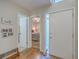 Bright foyer featuring hardwood floors, access to the bedroom, and a modern aesthetic at 2765 Jobee Dr # 1303, Charleston, SC 29414