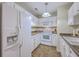 Functional white kitchen featuring modern appliances, ample cabinet space and easy to clean tile floors at 2765 Jobee Dr # 1303, Charleston, SC 29414