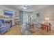 Cozy living room featuring hardwood floors, a fireplace, and a sliding door for natural light at 2765 Jobee Dr # 1303, Charleston, SC 29414