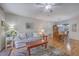 Open living room flowing to the dining area, with hardwood floors and neutral decor at 2765 Jobee Dr # 1303, Charleston, SC 29414