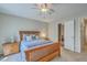 Inviting main bedroom with bright windows and a wooden bed and bedside table at 2765 Jobee Dr # 1303, Charleston, SC 29414