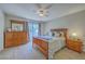 Comfortable main bedroom with light-filled windows and a large wooden dresser and bedside table at 2765 Jobee Dr # 1303, Charleston, SC 29414