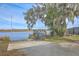 Scenic waterfront view with dock, picnic table, and lush landscaping at 2765 Jobee Dr # 1303, Charleston, SC 29414