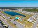 Aerial view of community pool, clubhouse and surrounding homes in a residential area at 286 Godwit Dr, Summerville, SC 29486